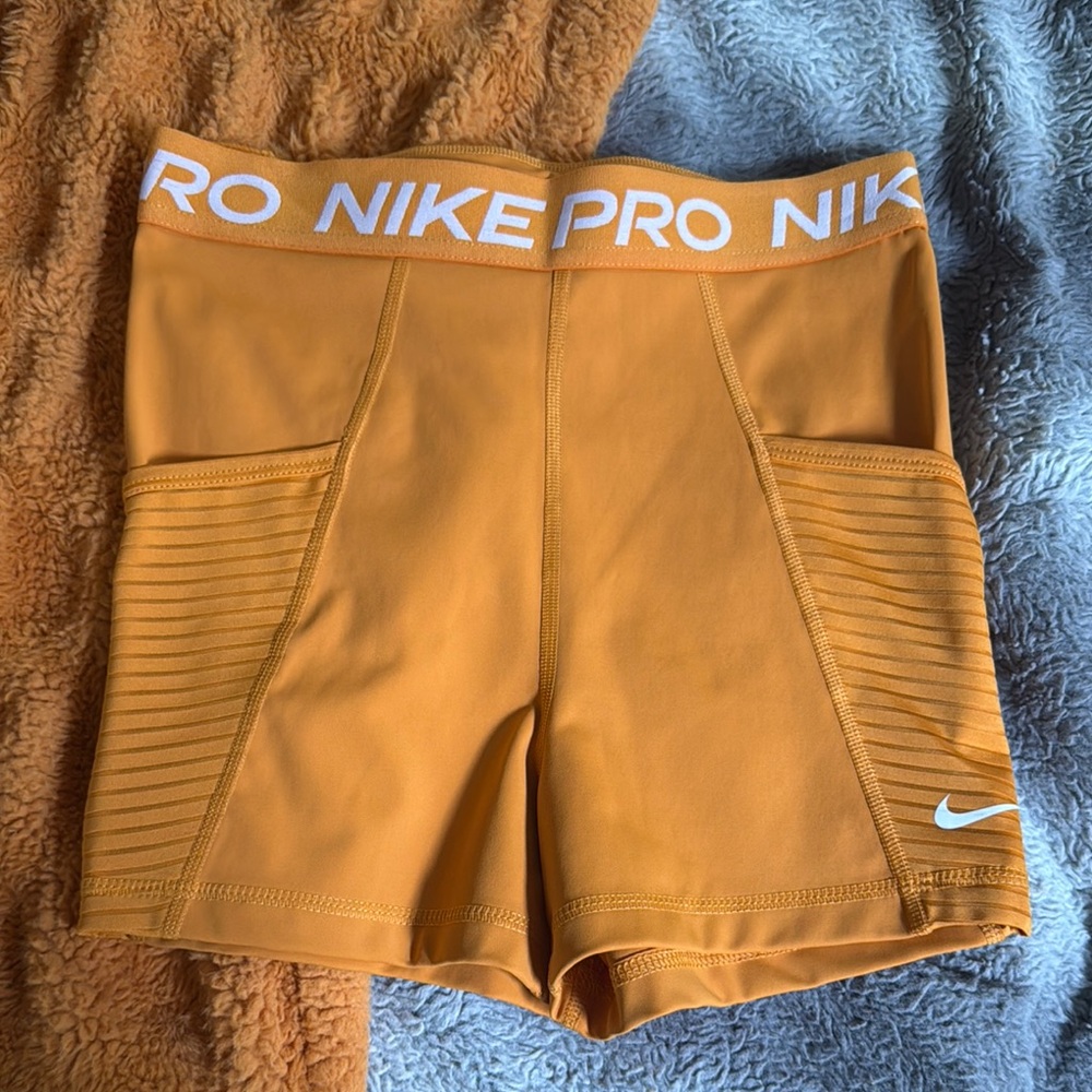Nike Pro Women's Athletic Shorts Orange/yellow color, small, with pockets